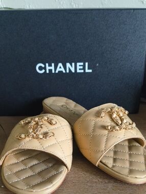 CHANEL Quilted Beige Leather Slide Mules with Gold Chain CC